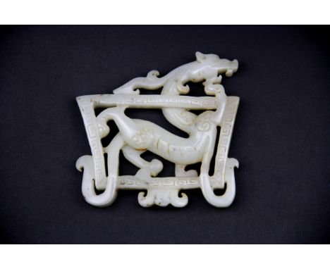 A lovely Chinese mutton fat jade dragon amulet entwined in a box shaped surround , 7.5 x 8 x 1cm.