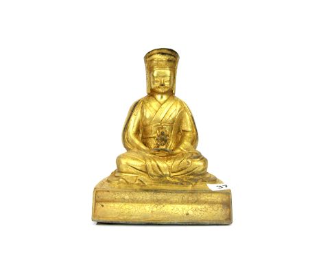 A Tibetan built bronze figure of a seated Buddhist Deity, H. 22cm.Condition: Base is detached.