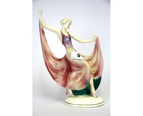 An original Art Deco German porcelain figurine of a young woman dancing, H. 25cm.