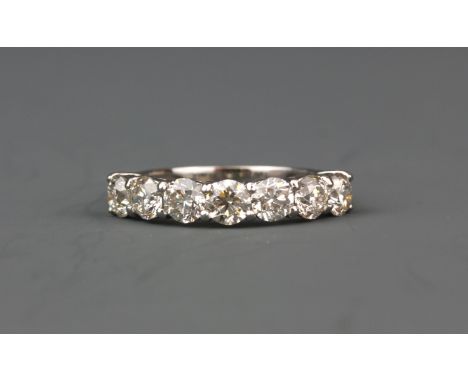 An 18ct white gold ring set with seven brilliant cut diamonds, approx. 2.18ct overall, (N.5).