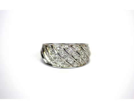 A 9ct white gold diamond pave set ring, (O).