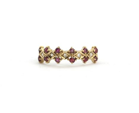 A 9ct yellow gold ruby and diamond set ring, (O).