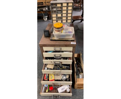 A small filing cabinet of mixed radio related tools, parts and an extensive quantity of transistors.