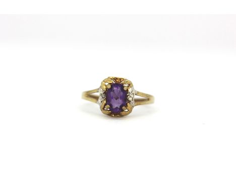 A 9ct yellow gold amethyst and diamond set ring, (Q).