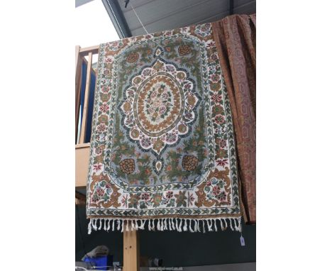 A Crewel work Rug having central panel of stylised flowers and foliage on mounted green ground surrounded with a cream ground