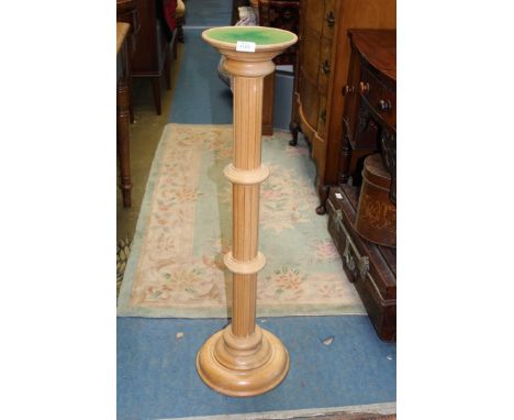 A light wooded column jardiniere stand, 39" tall.