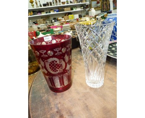 A large red and etched glass vase with church, bird and stag decoration and a tall cut glass vase, 10" and 11 3/4" tall.