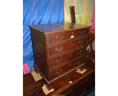 A Georgian Oak Commode standing on bracket feet, 27 1/2'' wide x 18 1/2'' deep x 28 3/4'' high.