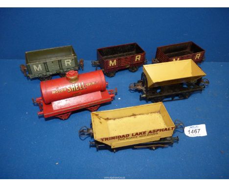 A quantity of Rolling stock 'O' gauge - red 'Motor Shell Spirit' tanker, yellow 'Trinidad Lake Asphalt' tipper truck, yellow 