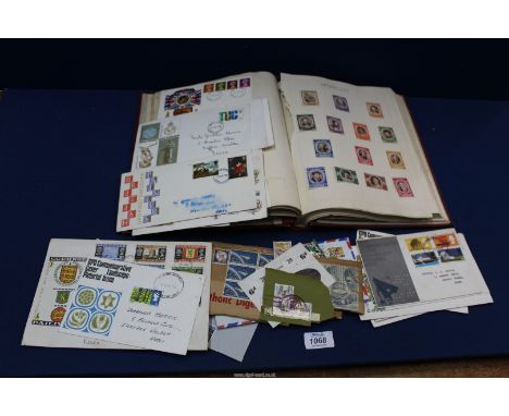 A red Stamp Album containing Stamps and First Day Covers including; English and Foreign stamps, 60's/70's First Day covers. P