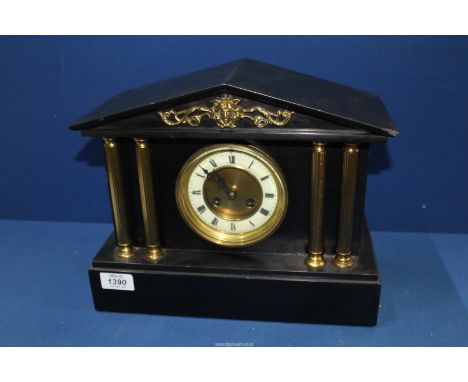 A slate Mantle Clock with gilt pillars, the movement by F. Martin, Paris, 13'' wide x 10 1/2'' high.