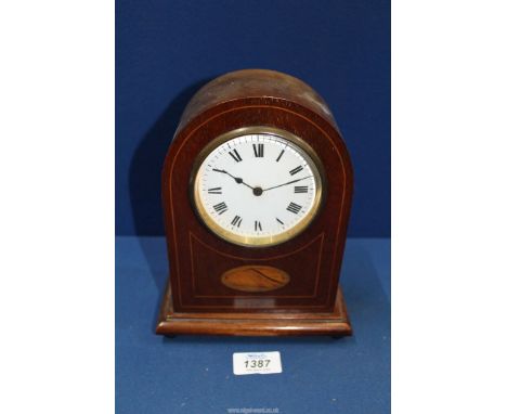 A Mantle clock with shell marquetry design, with key, 8 1/2" tall x 6 1/2" wide.