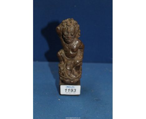 A Javanese carved wood kris handle in the form of Mahakala, 18th century, 6 1/4'' tall including stand.
