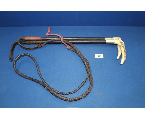 Two Antler handled leather covered riding crops by Swaine, one with carriage whip attached.