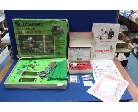 A vintage Golf training AFBS and Subbuteo Football set (incomplete) and 1920's Golf adverts and music sheets.