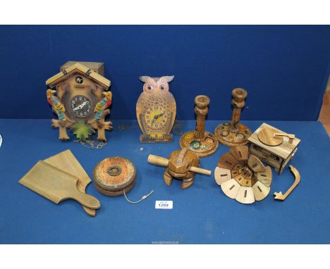 A box of treen including; cuckoo & wobble eye clock, butter pats, etc.