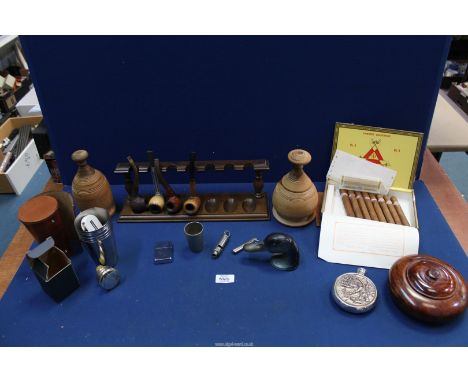 A quantity of miscellanea in part box of Monte Cristo Habana cigars (8 inside), Metropolitan whistle, pipe rack, pipes, light