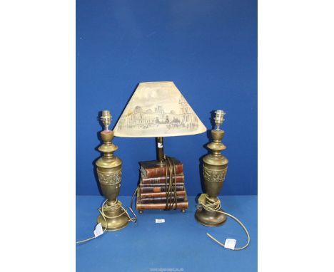 A lamp base made of stacked leather bound books with (Newspaper shade a/f) 22 1/2" tall and a pair of brass lamp base with st