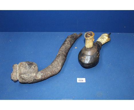 Two large and rare early 20th century ceremonial African pipes, the smaller one is from the Luba tribe in central Africa and 