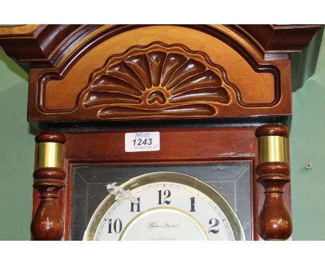 An Oak cased Wall Clock having a two train spring driven movement (ran briefly during lotting), glass to door absent, 25 3/4'