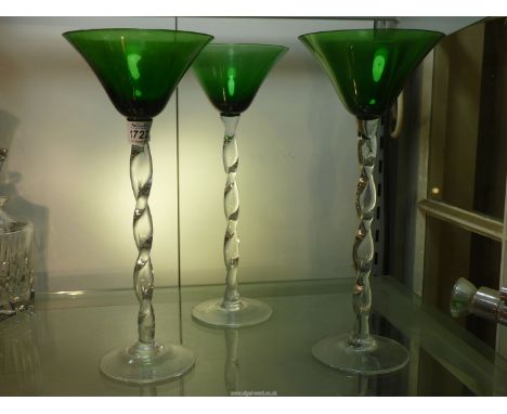 Three glass table centrepieces, clear spiral stems and base with green glass bowls, 12" tall.