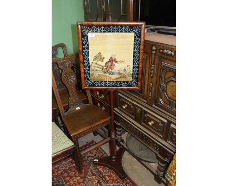 A Regency period, circa 1820, needle point tapestry Firescreen with beaded decoration to border.