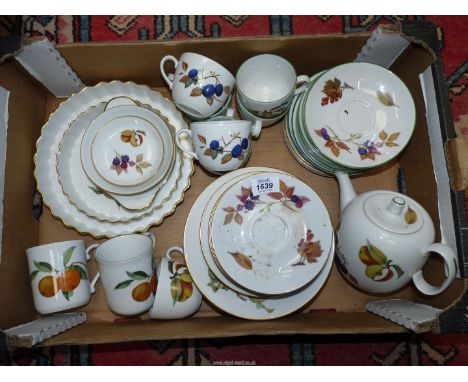 A quantity of Royal Worcester 'Evesham' and 'Evesham Vale' tea ware including cups, saucers, teapot, etc.