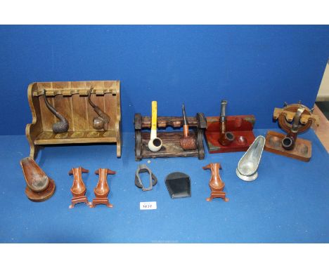 A tray containing four pipe racks, six single pipe stands and a mix of briar and meerschaum pipes, etc.