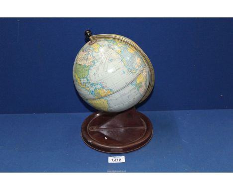 A Chad Valley tin plate Clock in form of a globe, 11" tall.