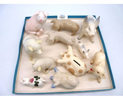 A small quantity of pigs including small Wemyss pig, two Belleek pigs, two Royal Dux pigs, Beswick, Goebel, etc.