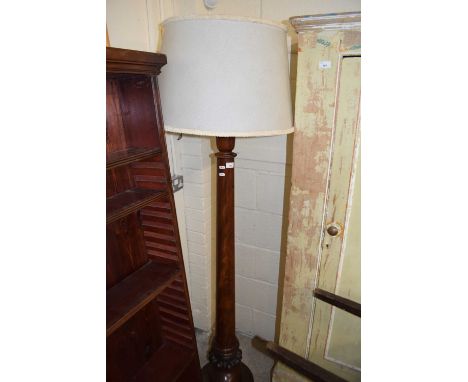 A large mahogany standard lamp with pale blue shade
