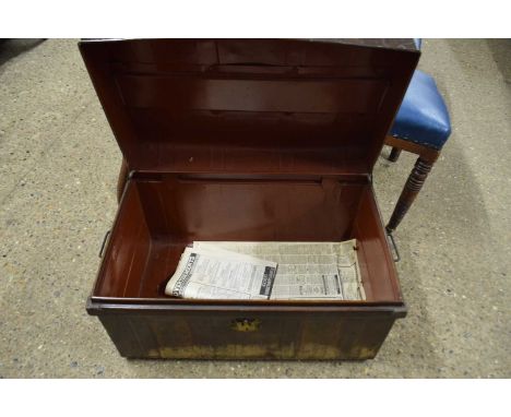A vintage metal trunk with wood effect finish
