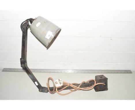 A vintage wall mounted industrial light fitting