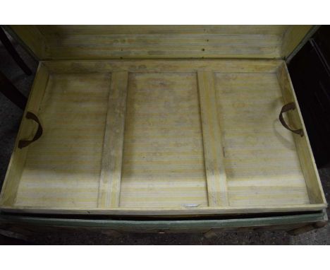A vintage wooden bound steamer trunk