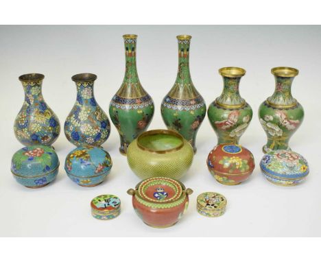 Group of mainly Chinese cloisonné enamel wares, 20th century, comprising three pairs of vases, bowl, four lidded circular pot