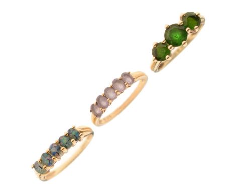 Three various 9ct gold dress rings, including a three-stone ring set green stones, and a synthetic-opal five-stone ring, 6g g