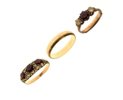 Garnet and white stone three-stone 9ct gold ring, a garnet and white stone dress ring, stamped '9ct', and a 9ct gold wedding 