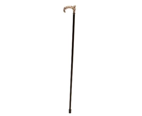 Ebony walking cane, of recent manufacture, with an 'Arabian Nights' themed silver handle, Birmingham 2000, sponsor's mark 'K 