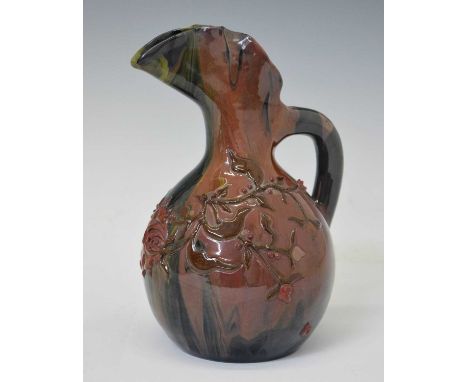 Elton Ware (Clevedon) pottery jug, ovoid form with shaped flared neck, decorated with flowering foliage on a streaked blue an