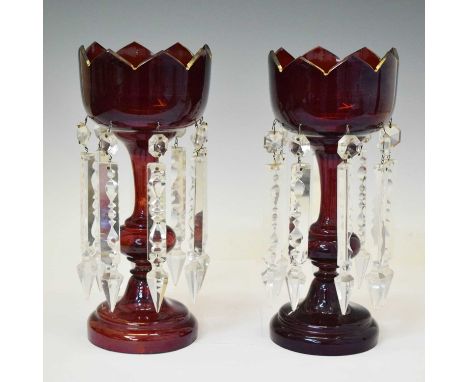 Pair of ruby flash and gilt highlighted glass candle lustres, each with eight droplets, 30cm high
