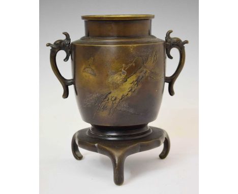 Japanese Meiji bronze vase, of ovoid form decorated with cranes and pine trees, between zoomorphic handles on tripod base, un
