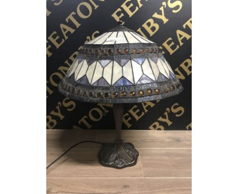 REPRODUCTION TIFFANY-STYLE TABLE LAMP the shade with motif and roundel detail overall, set on a copperised shaped base