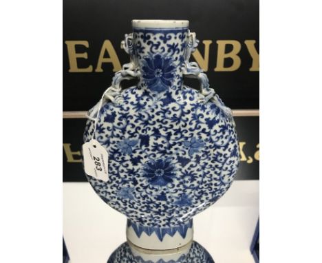 19thC CHINESE BLUE AND WHITE MOON FLASK decorated with overall with colourful foliage, finished with dragon handles, height 2