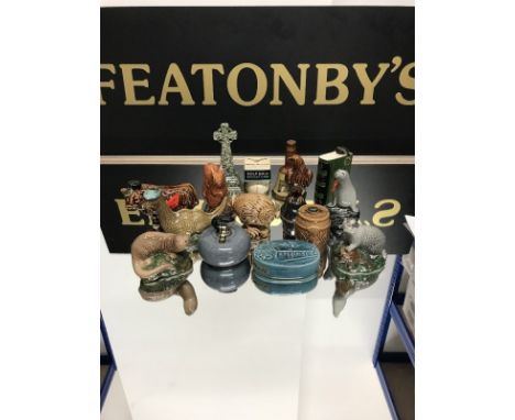 COLLECTION OF BENEAGLES WHISKY MINIATURE CERAMIC CONTAINERS some partly filled, including curling stone, Loch Ness Monster, S