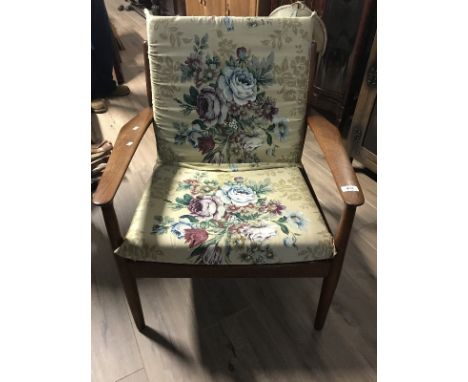 RETRO ERCOL EASY ARMCHAIR with floral upholstered cushions, raised on turned legs