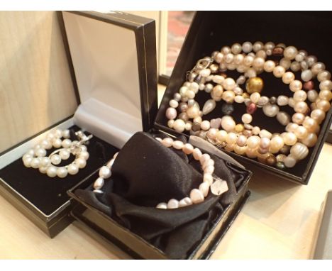 Two real pearl necklaces and two real pearl bracelets