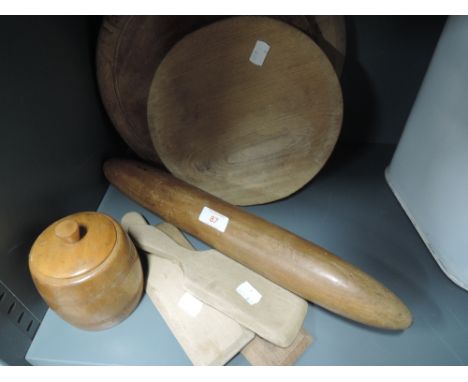 A selection of vintage wooden kitchen items including rolling pin bread boards etc