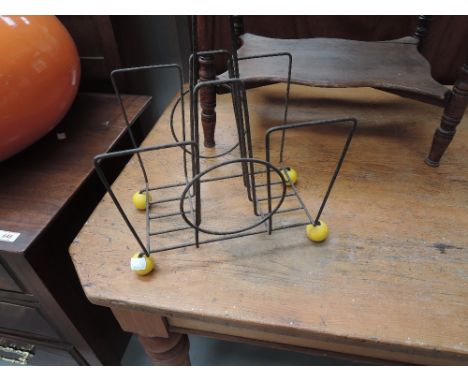 A vintage 'atomic' style magazine rack