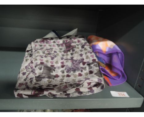 A selection of vintage silk scarf and throws 