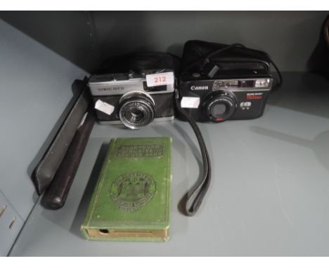 A selection of vintage photography cameras and equipment Olympus Trip 35